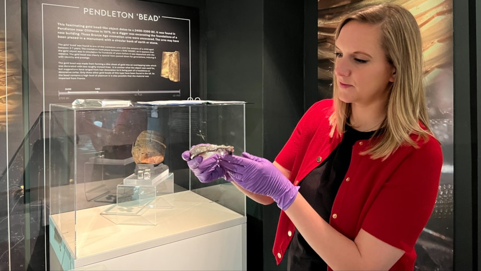 Sarah Austin, curator at Lancashire Museums, holds a silver armlet from the 'Silverdale hoard.'