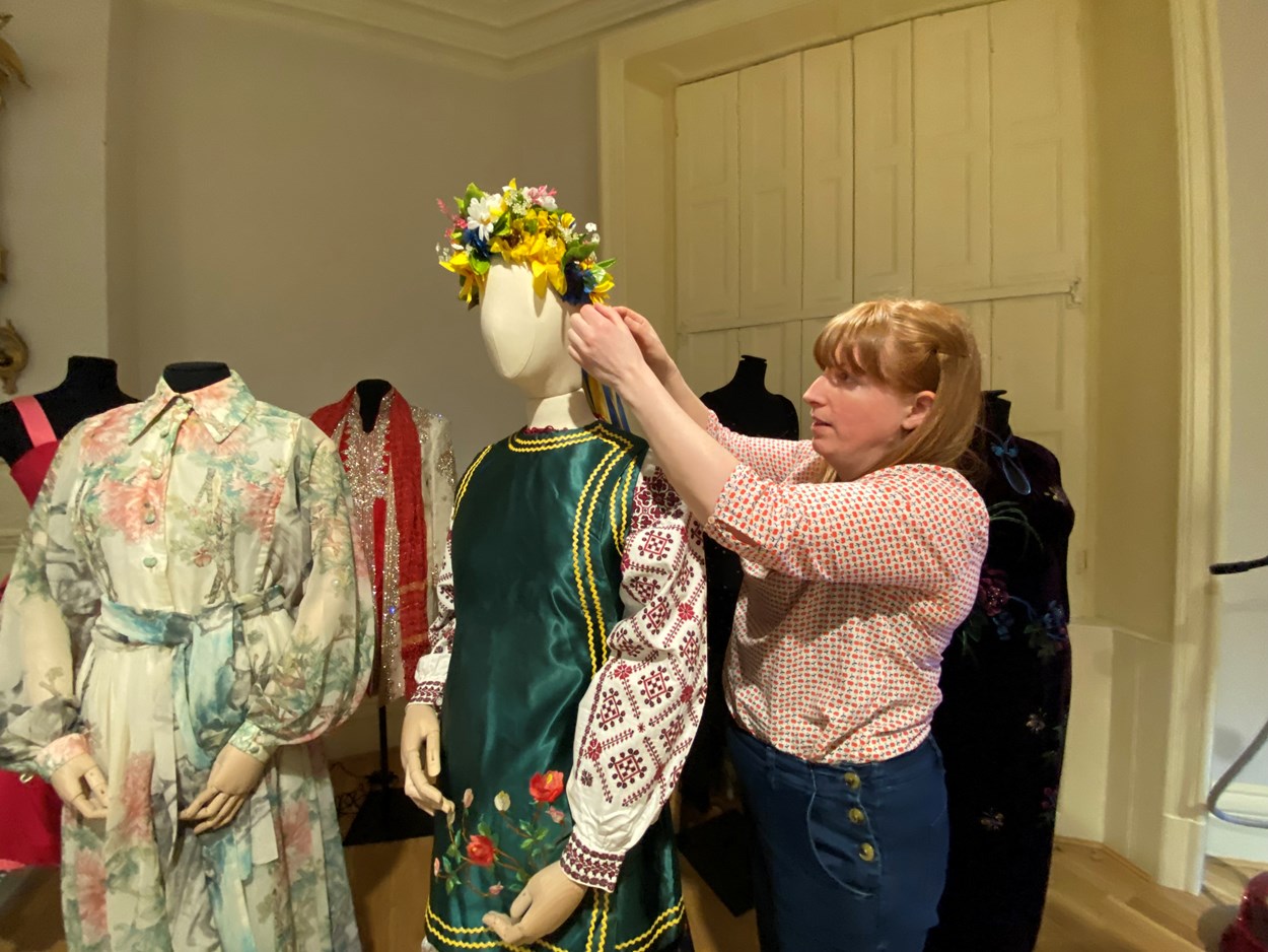 Ukrainian dress loan: Curator Natalie Raw works on the Ukrainian dress in the fashion gallery at Lotherton. From the central region of Ukraine, the costume consists of an embroidered shirt called a Vyshyvanka, which is worn along with a Vynok headdress and a sleeveless jacket called a Korstka.