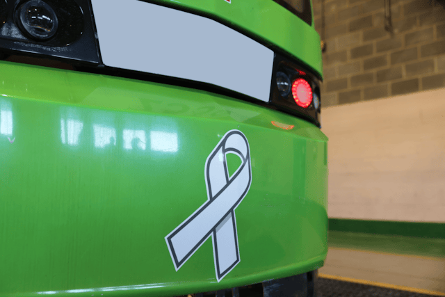 Tram showing white ribbon