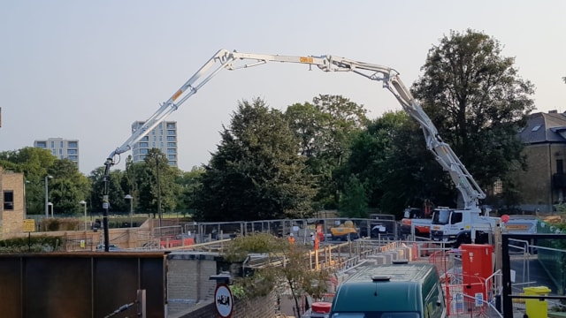 Pouring concrete to form the new bridge deck