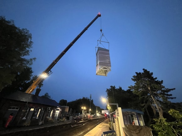 Lift shaft being craned over the track at Warwick station