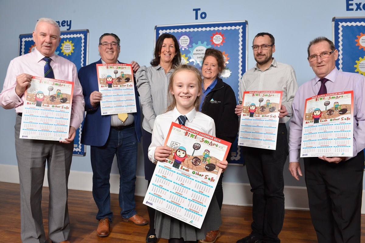 Eilidh Docherty with her winning entry in the Ayrshire Roads Alliance's South Ayrshire Road Safety Calendar 2019 competition on Thursday 29 November 2018 in Troon, South Ayrshire. With Eilidh are Councillor Peter Convery, Councillor Ian Cochrane, Angela Swan (Junior Road Safety co-ordinator),  Mary 