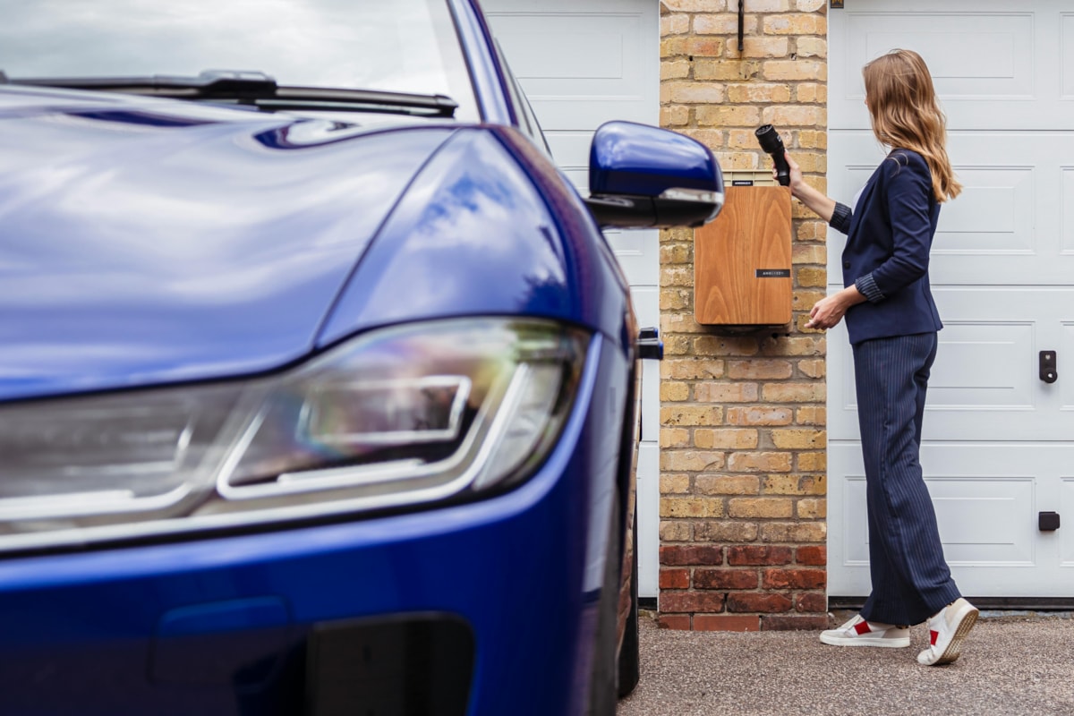 woman charging electric vehicle credit pexels-andersen-ev-