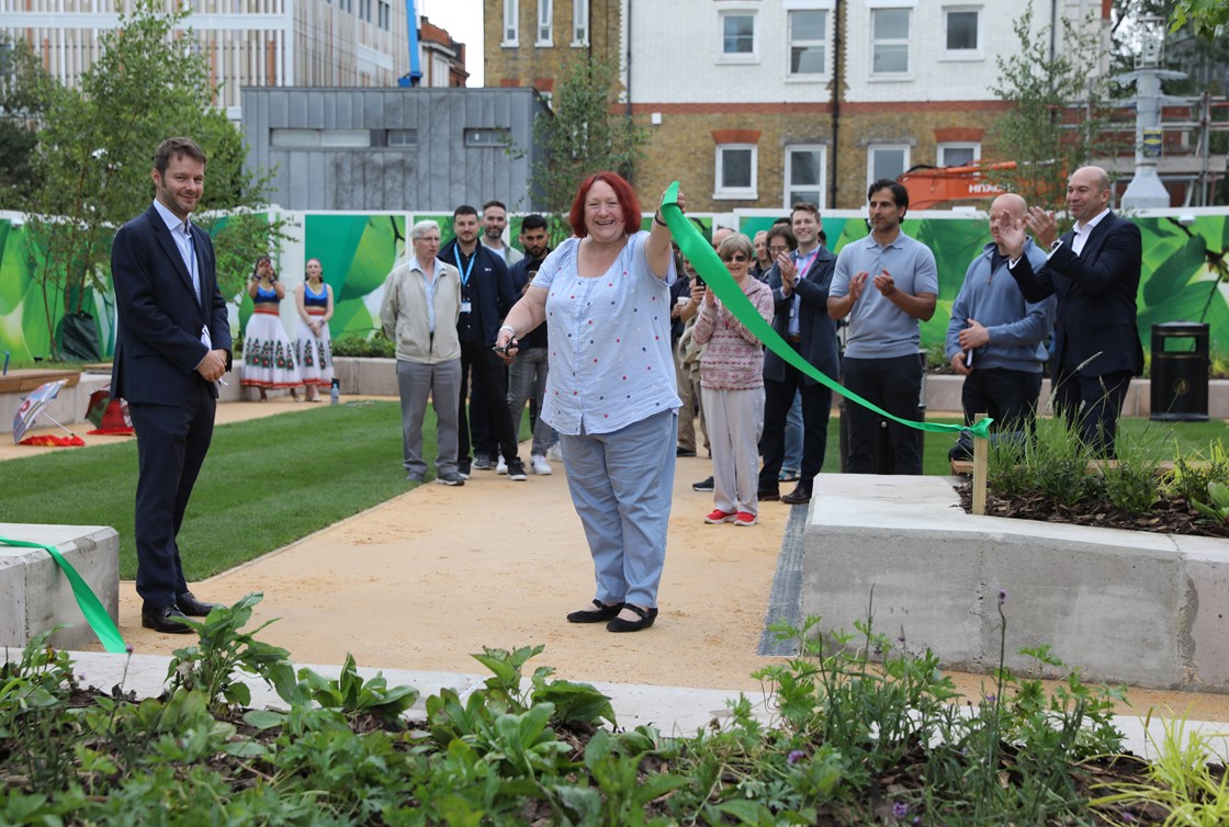 New temporary green space opens for community on HS2 site by Euston: Cllr Heather Johnson, Regents Park Ward, Camden Council, cuts the ribbon to open the new green space which has been created as part of HS2's meanwhile use programme.