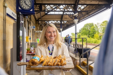Malton Station Food Festival, sasuage rolls being handed out by Area Customer Experience Manager, Georgina Young