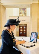 Cllr Annie Brewster, Chairman of Hertfordshire County Council, signing the Book of Condolence at County Hall