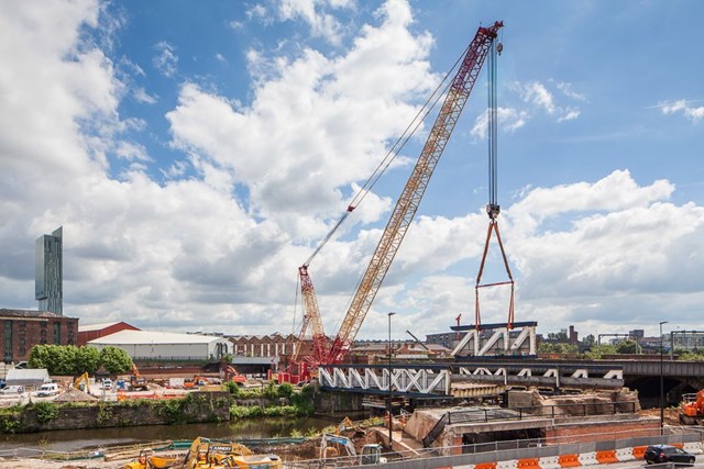 A crane in operation removing Princes Bridge