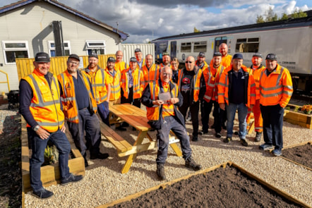 Image shows Mike with his colleagues at Newton Heath