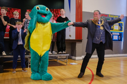 Provost Todd with Twiggle the Turtle dancing to Proud