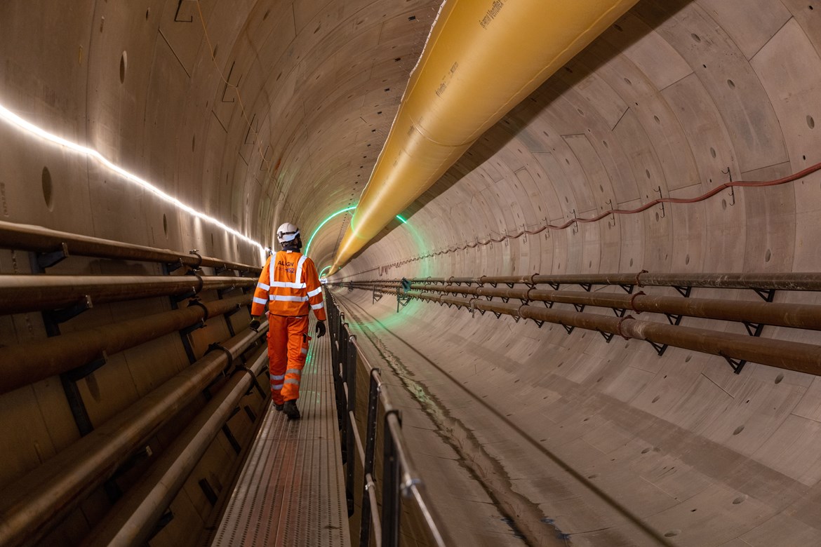 Tunnel progress as HS2 completes first mile under the Chilterns: Image of a man walking within the Chiltern tunnel autumn 2021 #28599-2