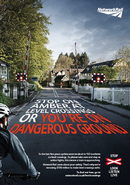 Level crossing safety campaigns Amber light warning cyclist poster