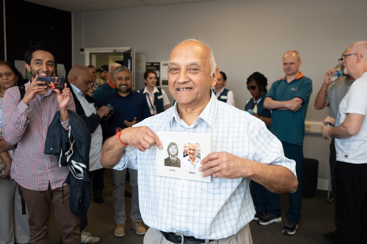 Shashi Vyas with a photo album documenting his 50 years on the railway