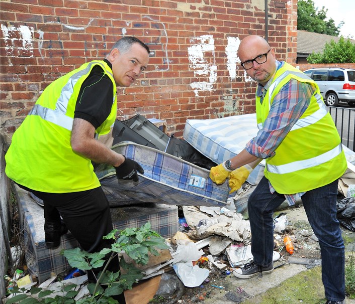 Councillor joins crews tackling flytipping: cllrdobsonclearingbinyard.jpg