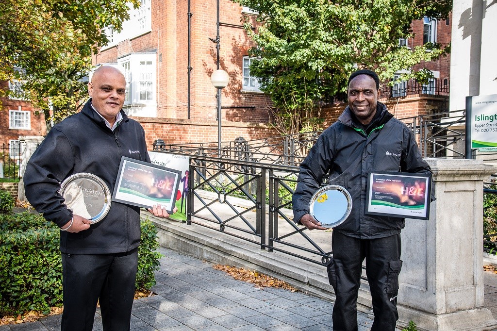 Lat Singh (pictured left) and Francis Oduro (pictured right) stand outside the Town Hall after winning the Concierge and Caretaker of the Year awards