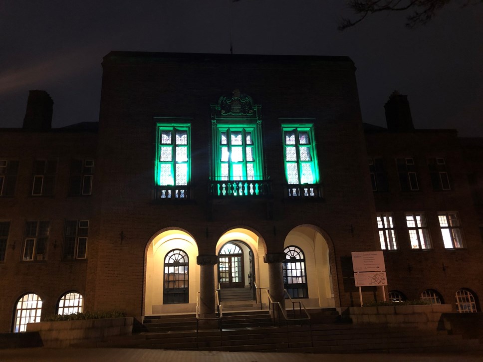 Council house lit in green