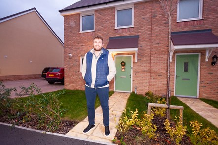 A man named Ollie stood outside his new shared ownership home in Williton, Somerset