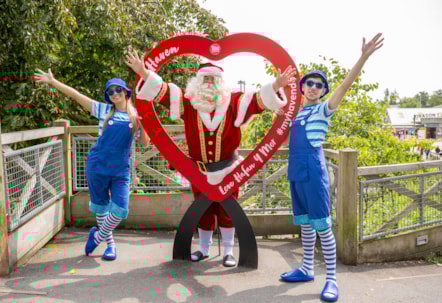 Santa and his Elves can't resist a quick pic