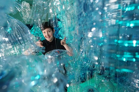 Curator Dr Ali Clark with the Bottled Ocean 2123 installation by George Nuku, part of a new exhibition, Rising Tide: Art and Environment in Oceania which opens Saturday 12 August at the National Museum of Scotland (credit Stewart Attwood)