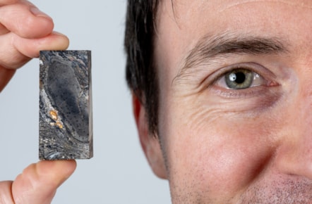 National Museums Scotland Research Associate Sandy Hetherington with sample of the 410 million year-old fossil of Prototaxites