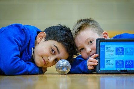 Adil and Ruaridh from p6 at Gargieston Primary operate a robot