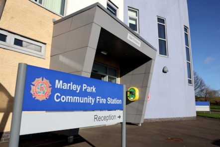 Main entrance of Marley Park Community Fire station with the sign in front of it.