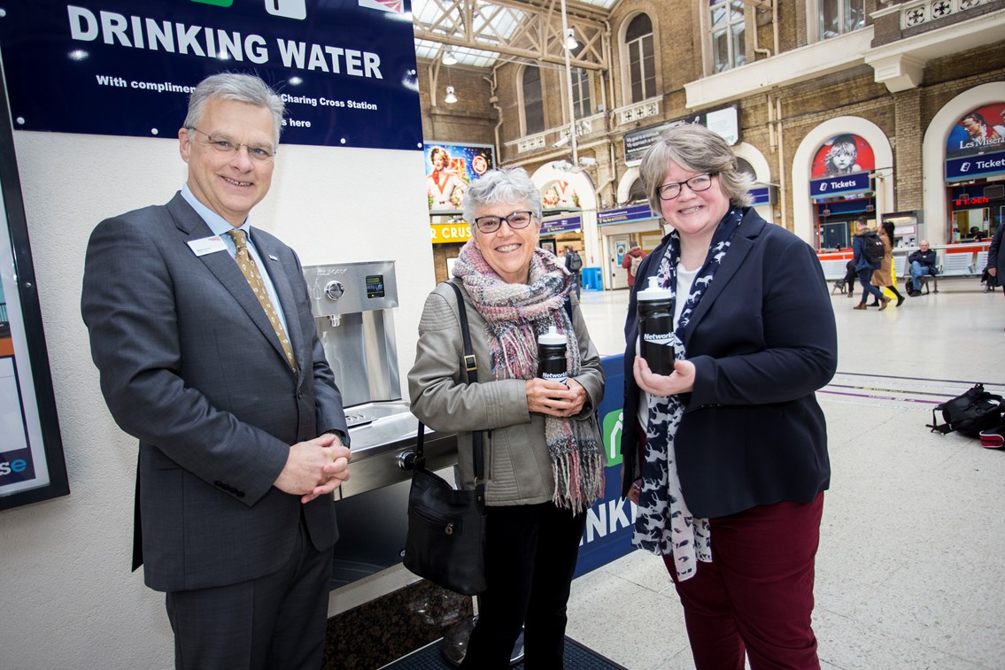 Free drinking water on tap for Kent, Sussex and South East London rail passengers at Charing Cross: First water fountain user at London Charing Cross is Sheila Pearce of Chislehurst. Also pictured Network Rail's chief executive  Mark Carne and Thérèse Coffey MP, Parliamentary Under Secretary of State at DEFRA
