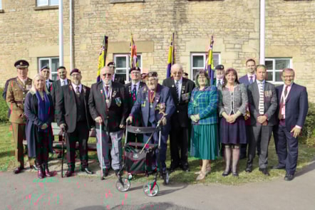 Dignitaries gather at the flag raising ceremony for D-Day at the Cotswold District Council office