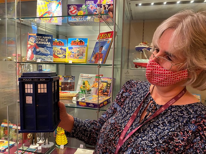 Abbey House toy display: Kitty Ross, Leeds Museums and Galleries' curator of social history with a toy version of Dr Who's Tardis.