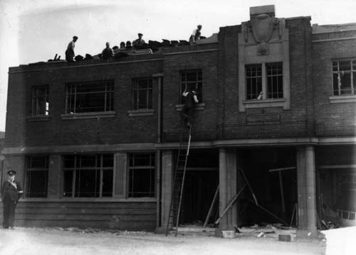 Woodpecker Inn, bomb damage: View shows the Woodpecker Inn, at the junction of York Road and Marsh Lane, undergoing rebuilding work after being damaged during the air raid on Leeds on the night of 31st August 1940, when a small number of bombs fell on the area. 
Copyright: Leeds Libraries