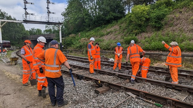 Team from Network Rail being given briefing from East Lancashire Railway maintenance team: Team from Network Rail being given briefing from East Lancashire Railway maintenance team
