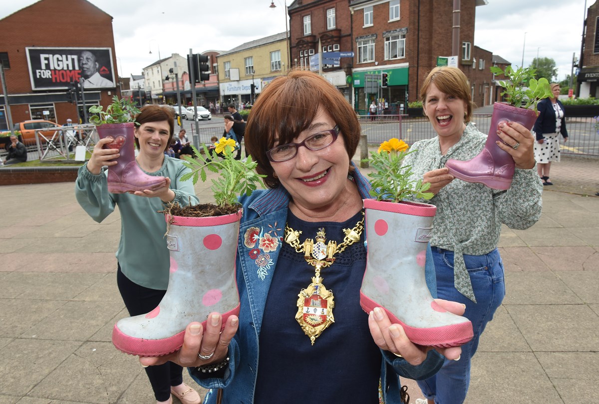 The Mayor of Dudley, Cllr Anne Millward, with the unique planters helping Brierley Hill bloom