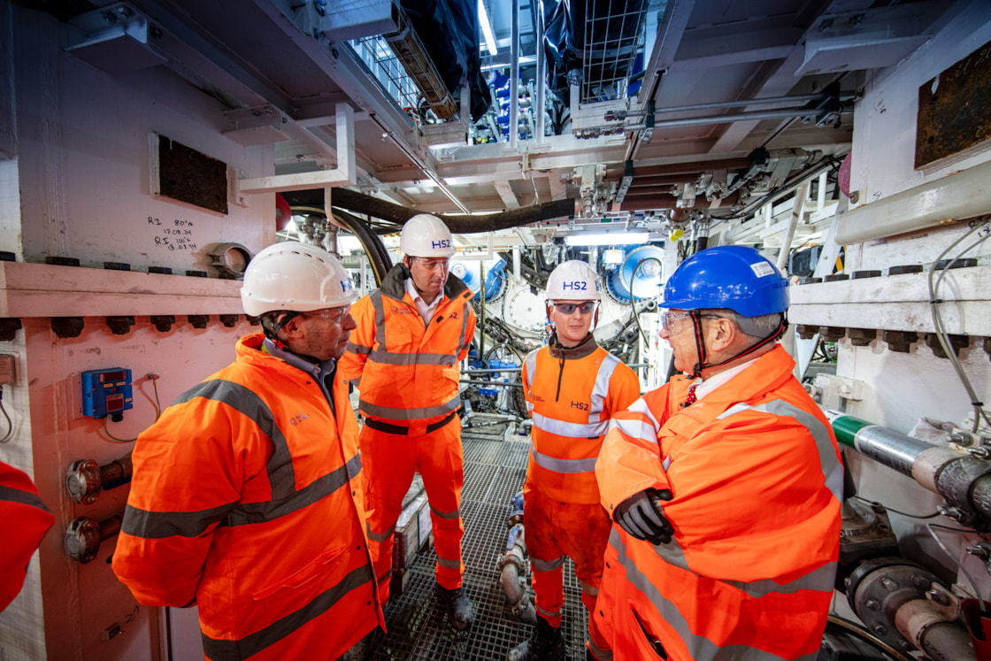 Rail Minister and new HS2 CEO at Old Oak Common station box to see Euston TBMs: L-R: Mark Wild, HS2 CEO; James Richardson, Managing Director, SCS JV, Bailey Prett, Tunneling Apprentice, SCS JV, Lord Peter Hendy, Rail Minister