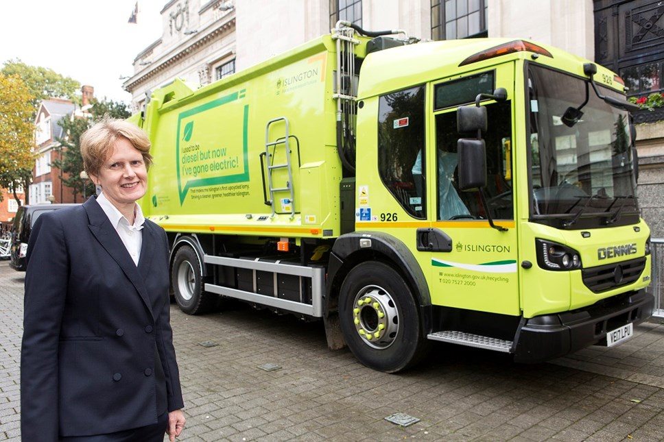 Cllr Champion alongside the retrofitted refuse collection vehicle