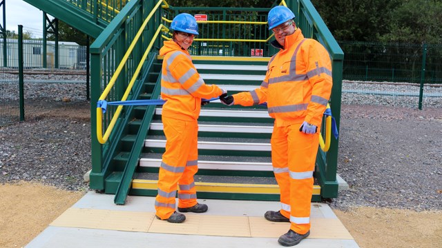 East West Rail installs ‘railway first’ footbridge in Bicester: Alan Sheldon, NR Senior Programme Manager and Karen Wood,  EWR Alliance Engineering Integration Manager officially opening new Jarvis Lane footbridge