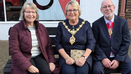 Brenda Stevenson, of Stourbridge u3a, on the new friendly bench with the Mayor of Dudley, Cllr Hilary Bills, and consort John