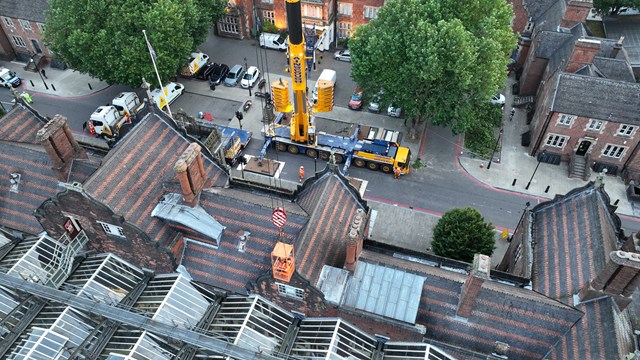 Aerial shot of workers removing a finial on Stoke on Trent station roof