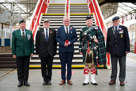 Avanti West Coast Customer Service Assistant, Anthony Stanley (centre), who served in the Army, joined Royal British Legion representatives at Crewe station to present a posy of poppies to the wreath