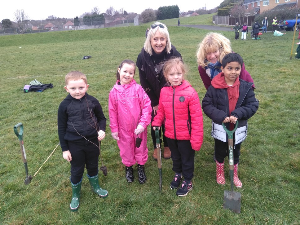 Cllr Karen Shakespeare (back left) plants trees with staff and pupils from Dudley Wood Primary School