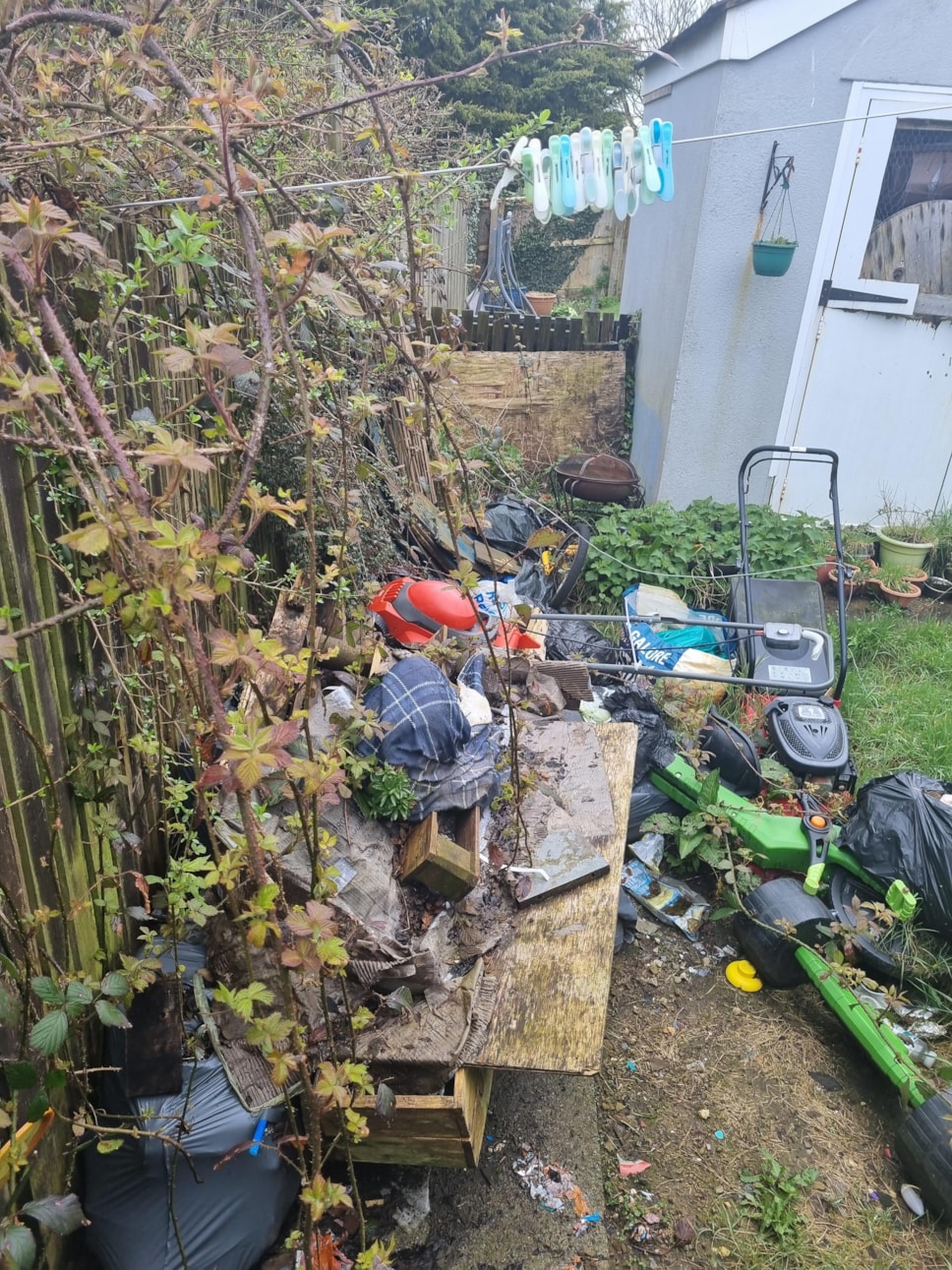 large amount of rubbish in garden