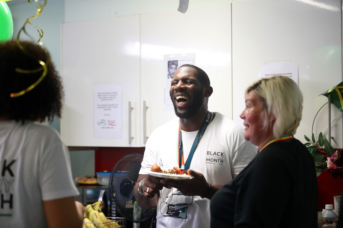 Camille Parchment & Jonathan Thomas, both Customer Service Assistant at Birmingham New Street, and Kelly Burton, Health and Wellbeing Partner, enjoying food at the event.