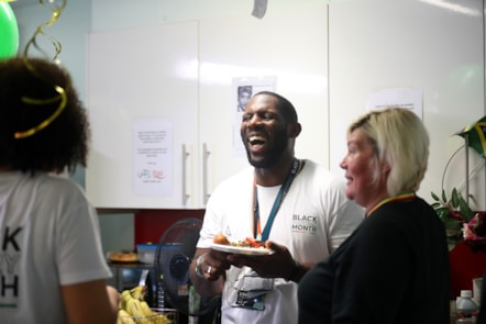 Camille Parchment & Jonathan Thomas, both Customer Service Assistant at Birmingham New Street, and Kelly Burton, Health and Wellbeing Partner, enjoying food at the event.