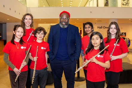 Poet Roger Robinson with the Music Education Islington flute ensemble - from left, Emiko Ando Latter, teacher Emma Harding, Rafi Pollard, Aksheya Ambadi, Raymi Saldana Rojas and Annabela Panayiotou.