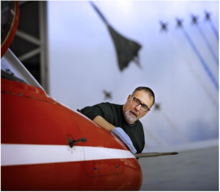 Principal Conservator, Stuart McDonald cleans a Red Arrows Hawk at the National Museum of Flight. Image (c) Paul Dodd (5)