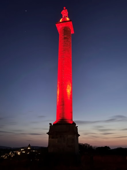 The Duke of Gordon's monument on Ladyhill in Elgin lit red.