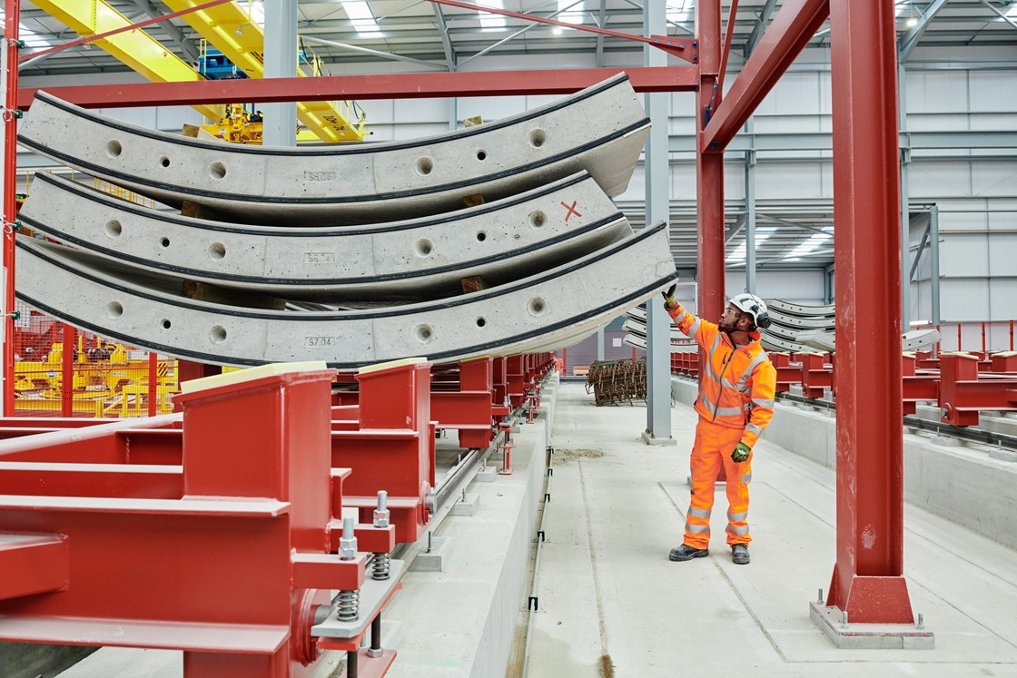 Engineer inspects a pre-cast concrete tunnel segment at HS2's Chiltern Tunnel on site factory in Hertfordshire HS2-VL-21912