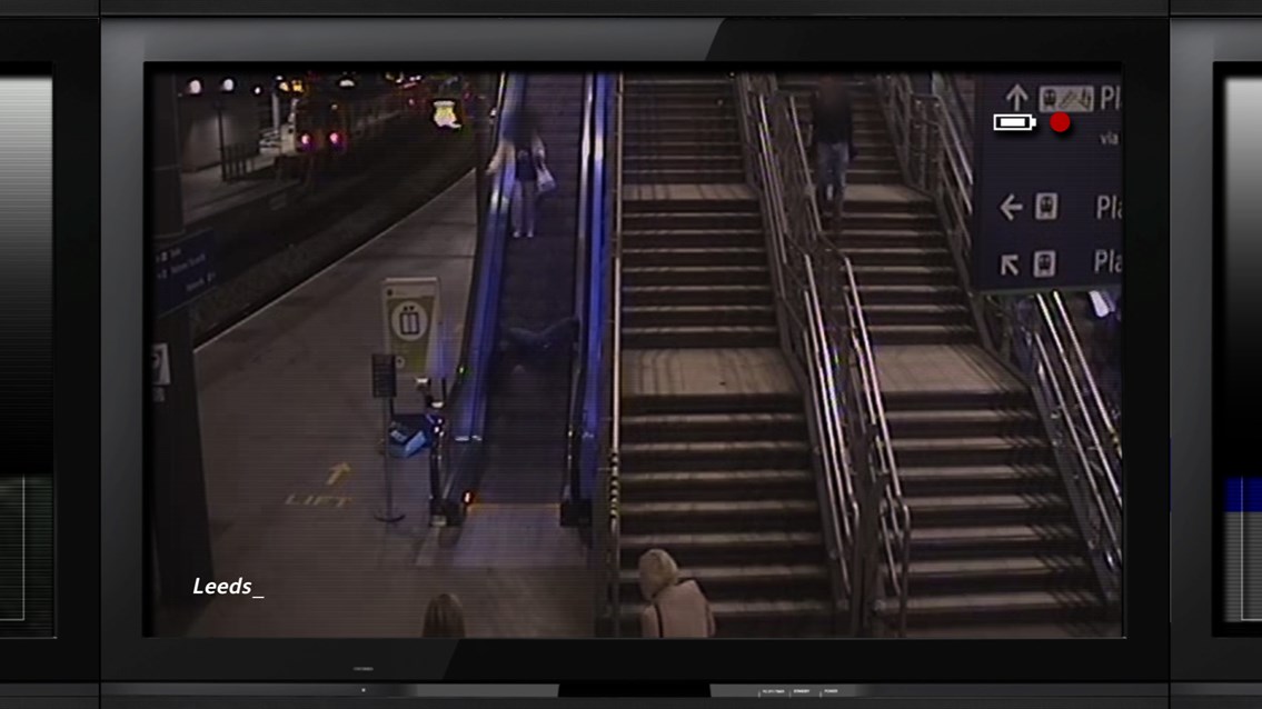 Station safety campaign - CCTV still image Leeds station. Man falls down escalator: Station safety campaign - CCTV still image Leeds station. Man falls down escalator