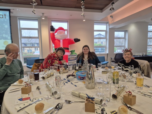 BristolChristmas2024-guests2: Michael, Sally, Imogen and Pauline at the lunch (left to right)