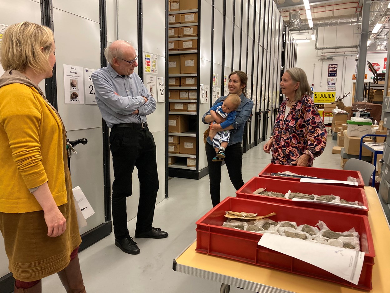 Fossil find: Curator Clare Brown shows Pauline's family the impressive fossilised remains of an Ichthyosaur which Pauline found on a beach in Whitby in 1949 and which  now stored at the Leeds Discovery Centre.