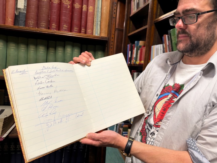 World Cup heroes at library: The book and photograph date from August 3, 1966 when then Lord Mayor of Leeds, Alderman Joshua S Walsh, hosted a prestigious civic reception honouring the victorious players at Leeds Civic Hall.
Pictured is special collections librarian Antony Ramm with the album.