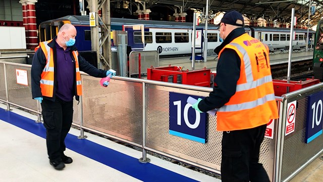 Tests show no traces of Covid-19 at Liverpool Lime Street station: Liverpool Lime Street cleaning handrails stock shot